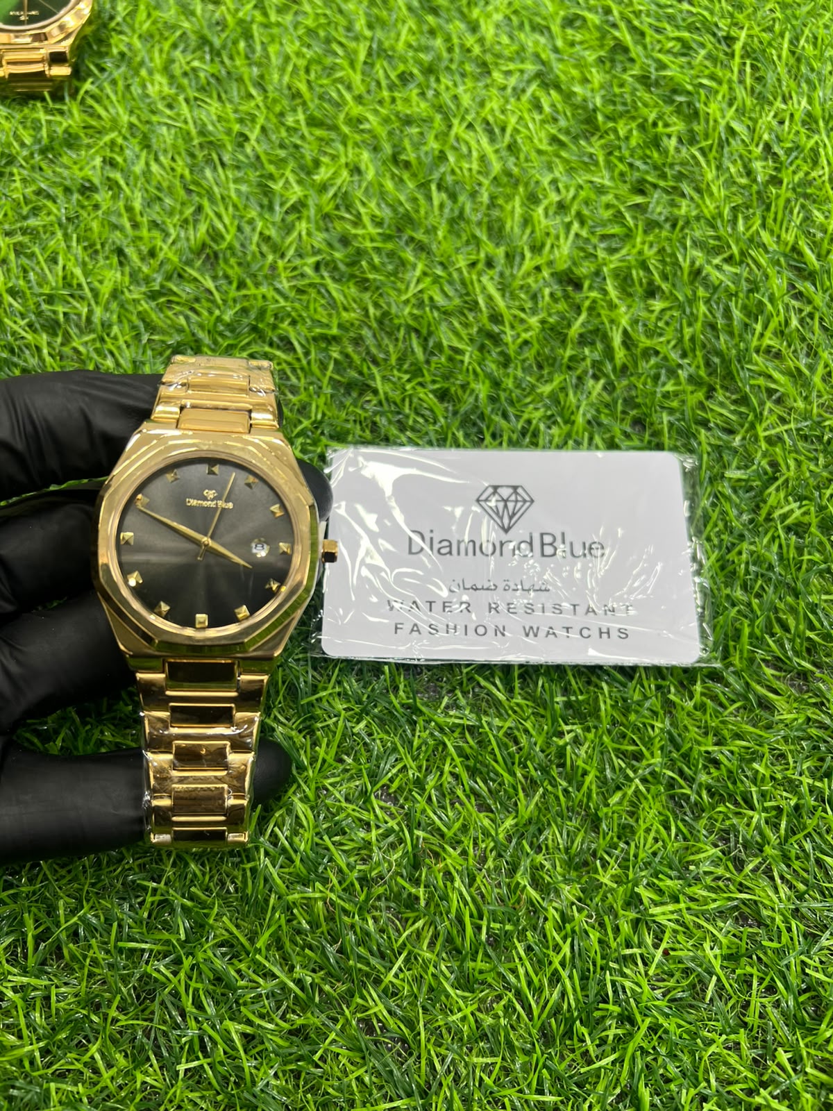 Gilded Shadow black dial gold bracelet watch