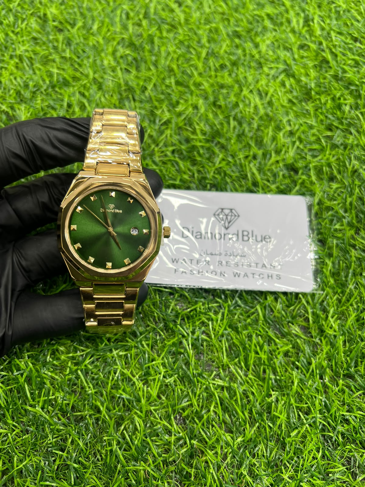 Emerald green dial gold bracelet watch