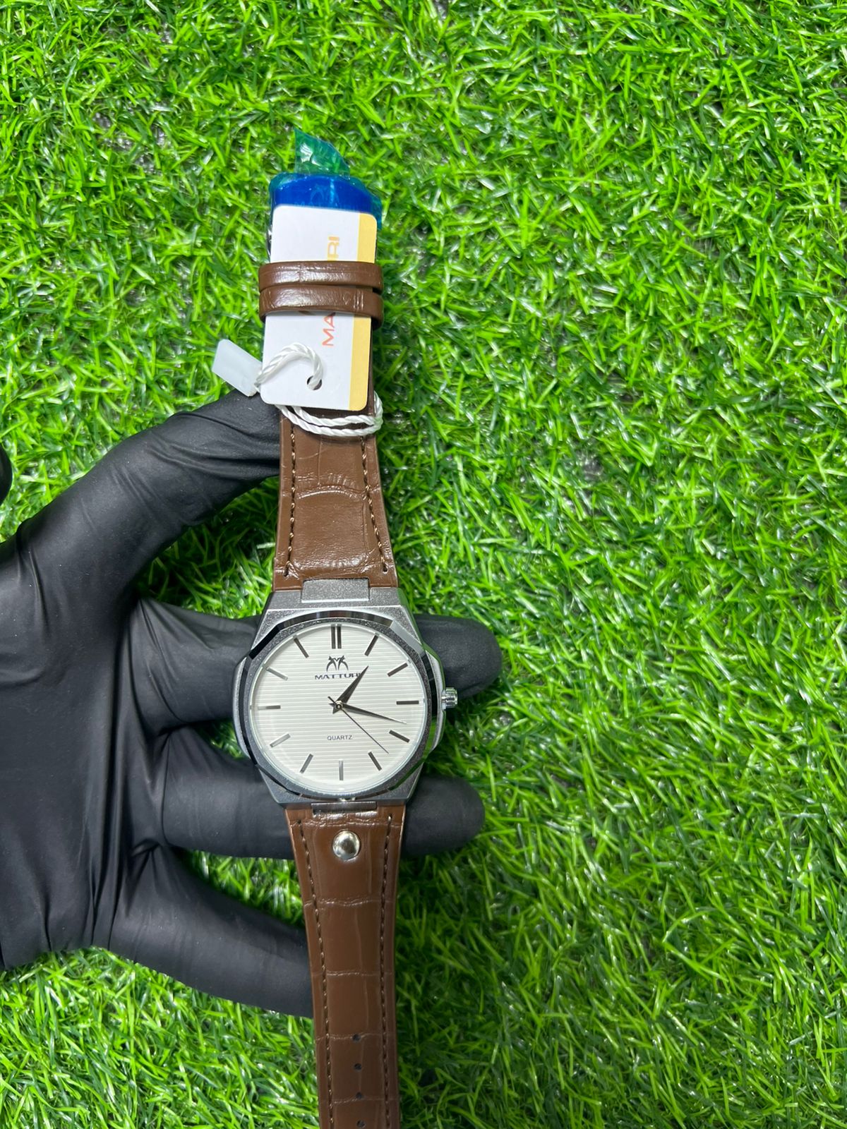 Meridian white dial brown strap watch