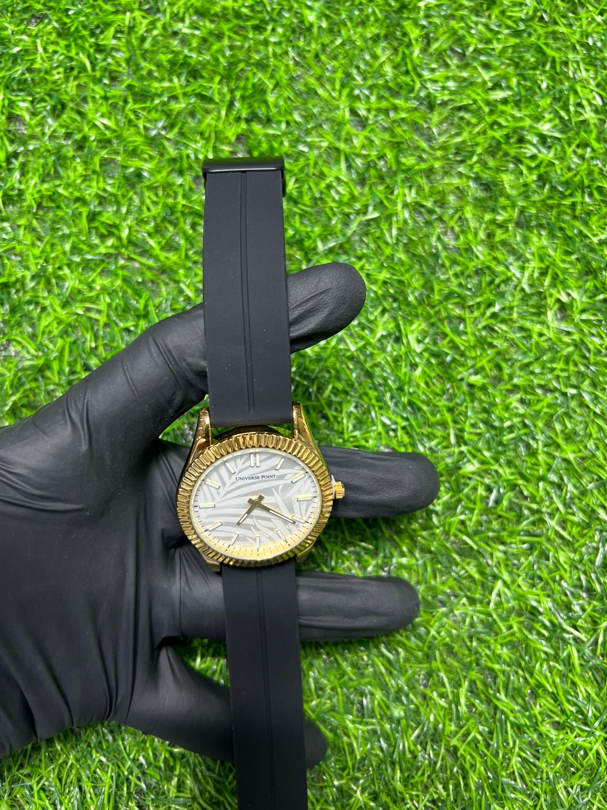 Ivory dial gold-tone watch with black strap